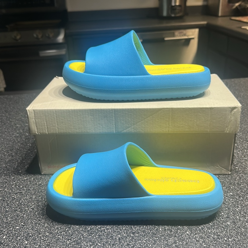 Brand new J slides in turquoise/yellow Eva squish. Women’s size 7M